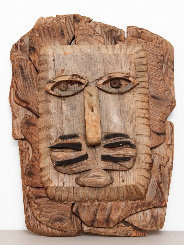 Wall-hanging sculpture of an abstracted lion's head