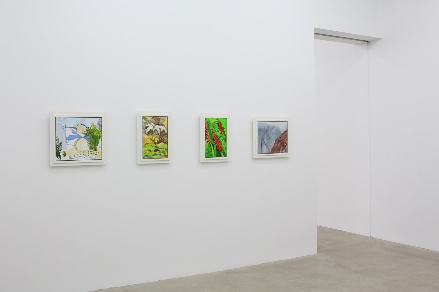 Photograph showing a view of an exhibition space, with four paintings hanging on a white wall