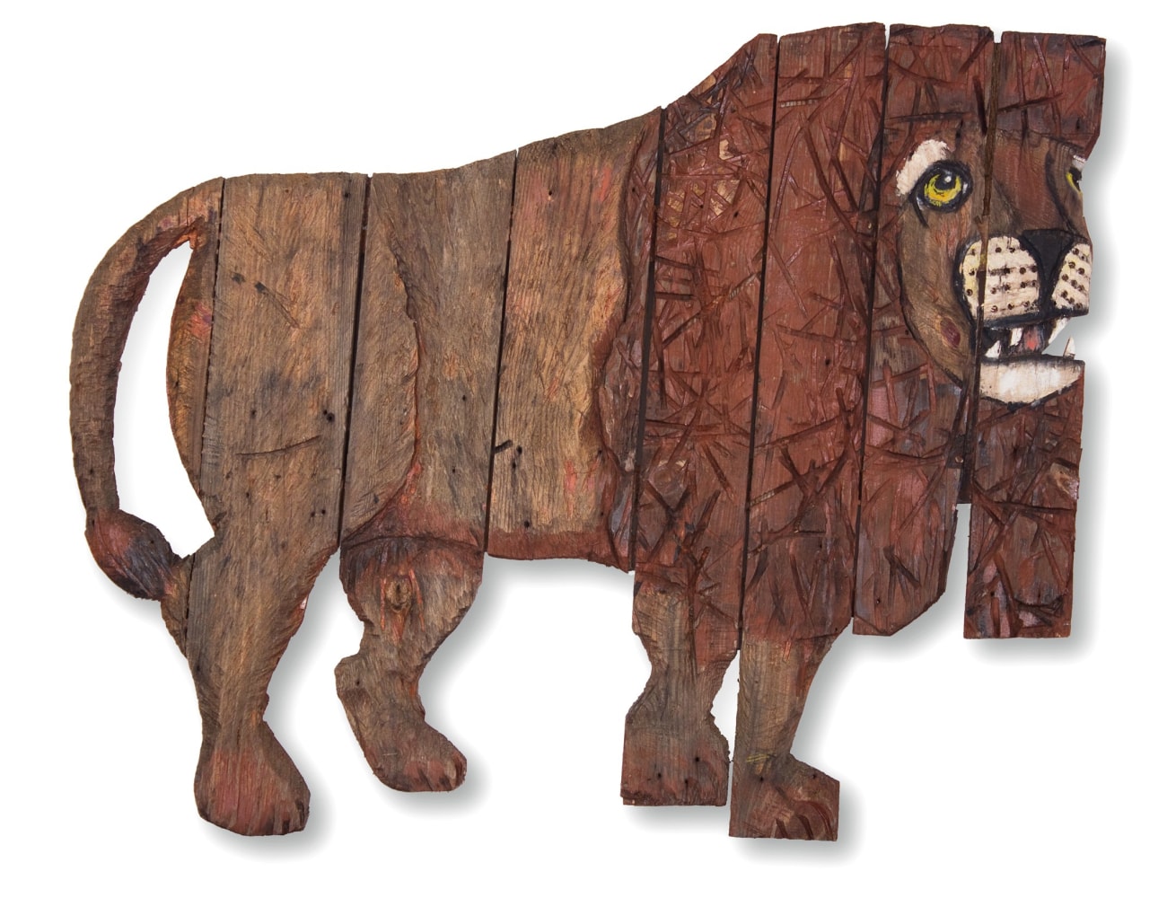 Wall-hanging sculpture of an abstracted figure of a lion composed of pieces of wood assembled together