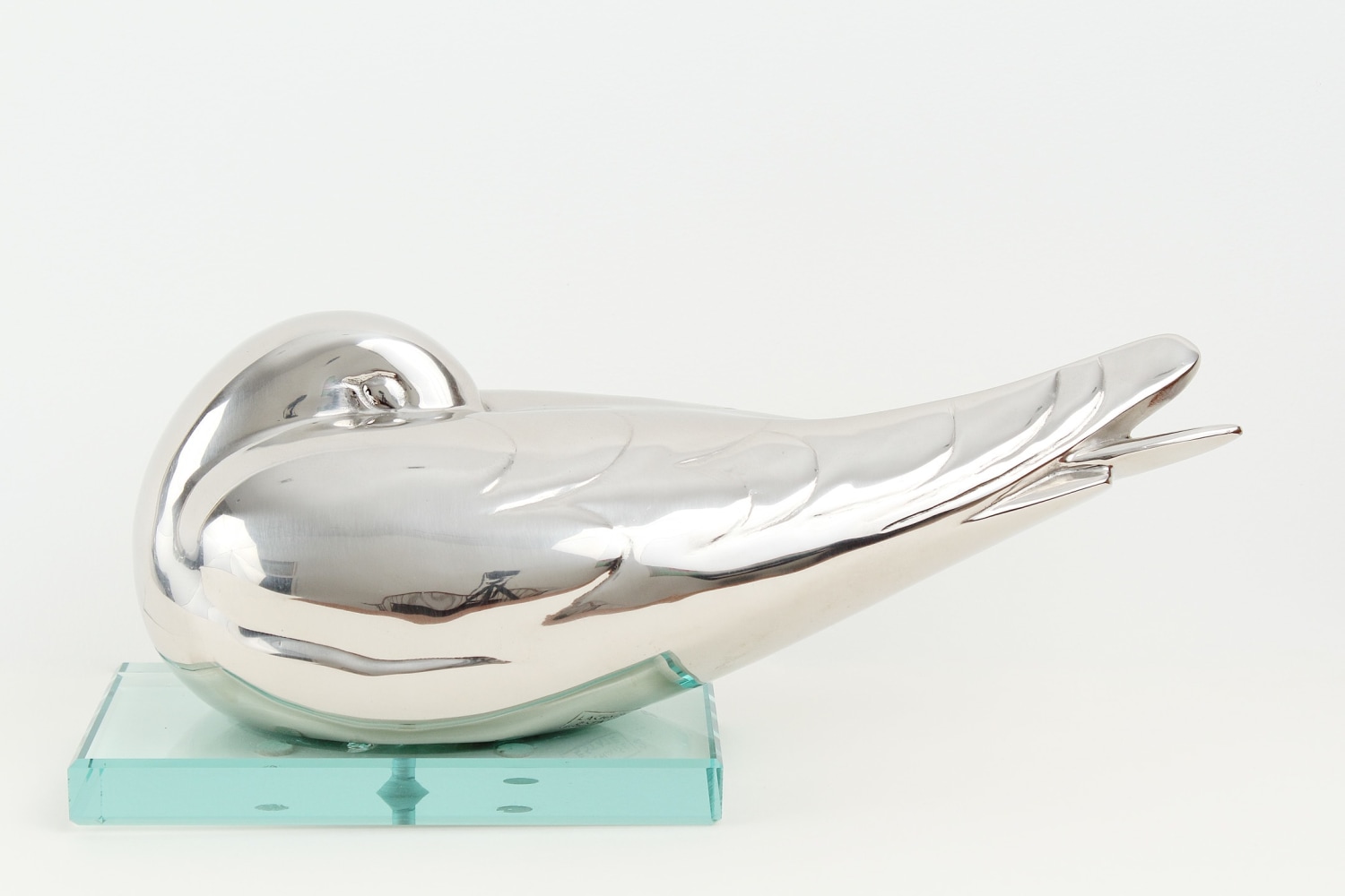 Sleeping Gull, 1920-1924, cast 2016, nickel-plated bronze, 5 x 12 inches on a single-tiered glass base, 2/12