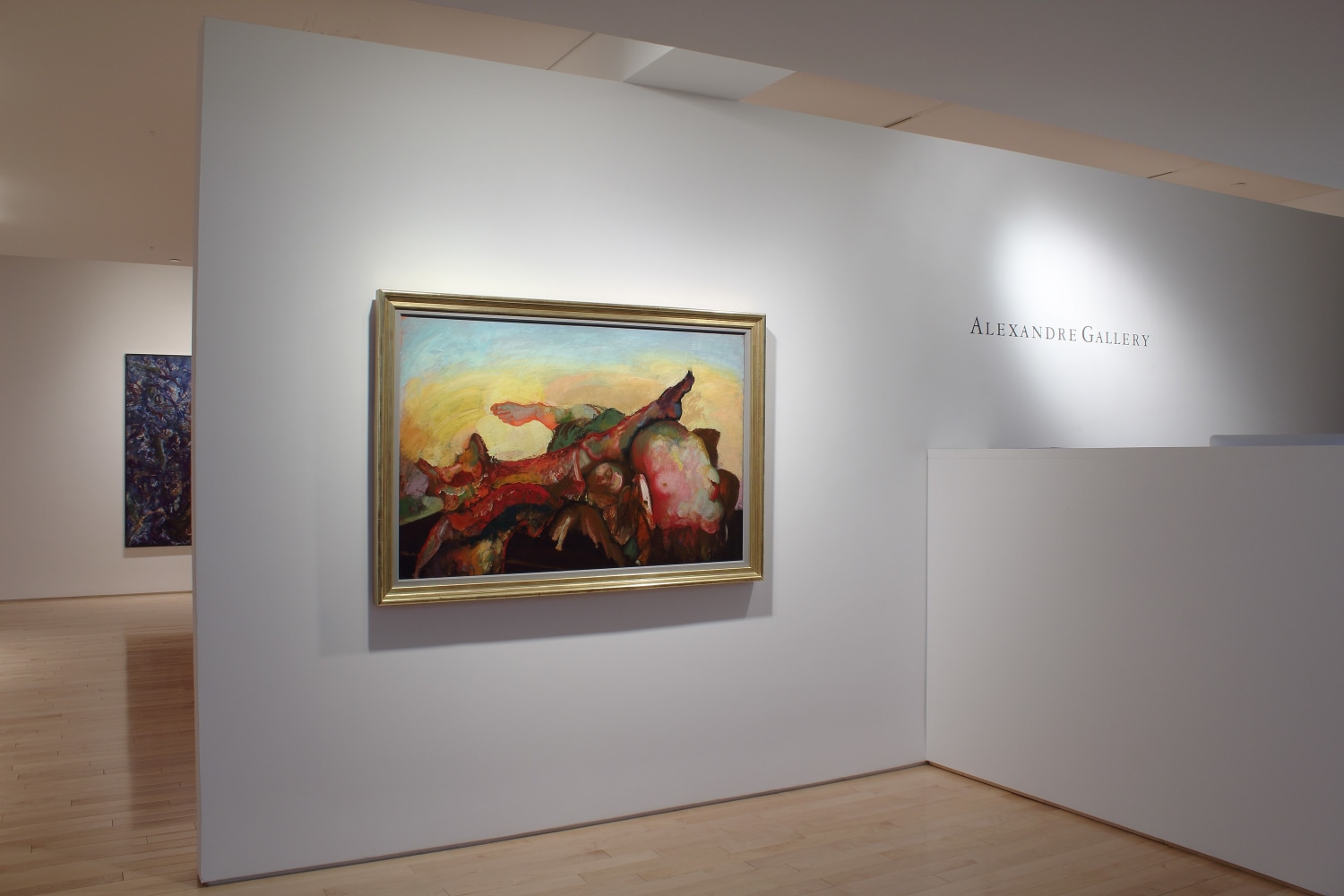 Photograph showing a front view of an exhibition space with two paintings hanging on white walls