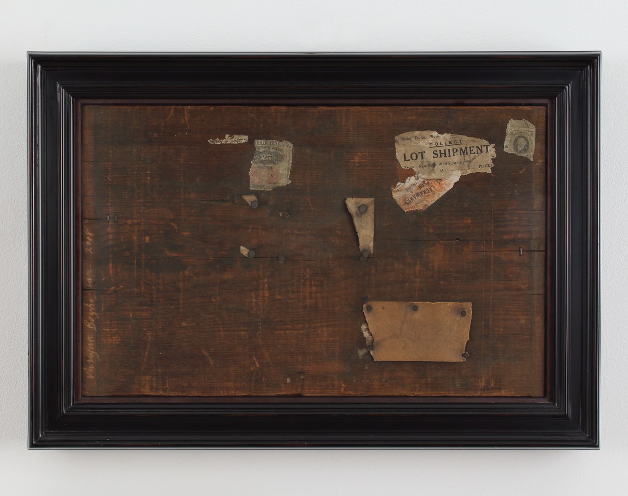 Framed collage constructed from wood and pieces of paper, with a piece of text that reads &quot;Collect Lot Shipment&quot; in the upper right corner