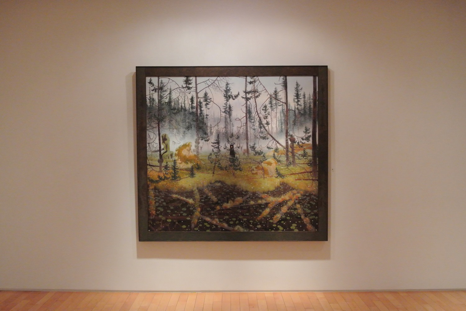 Photograph showing a view of an exhibition with one large framed painting hanging on a white wall