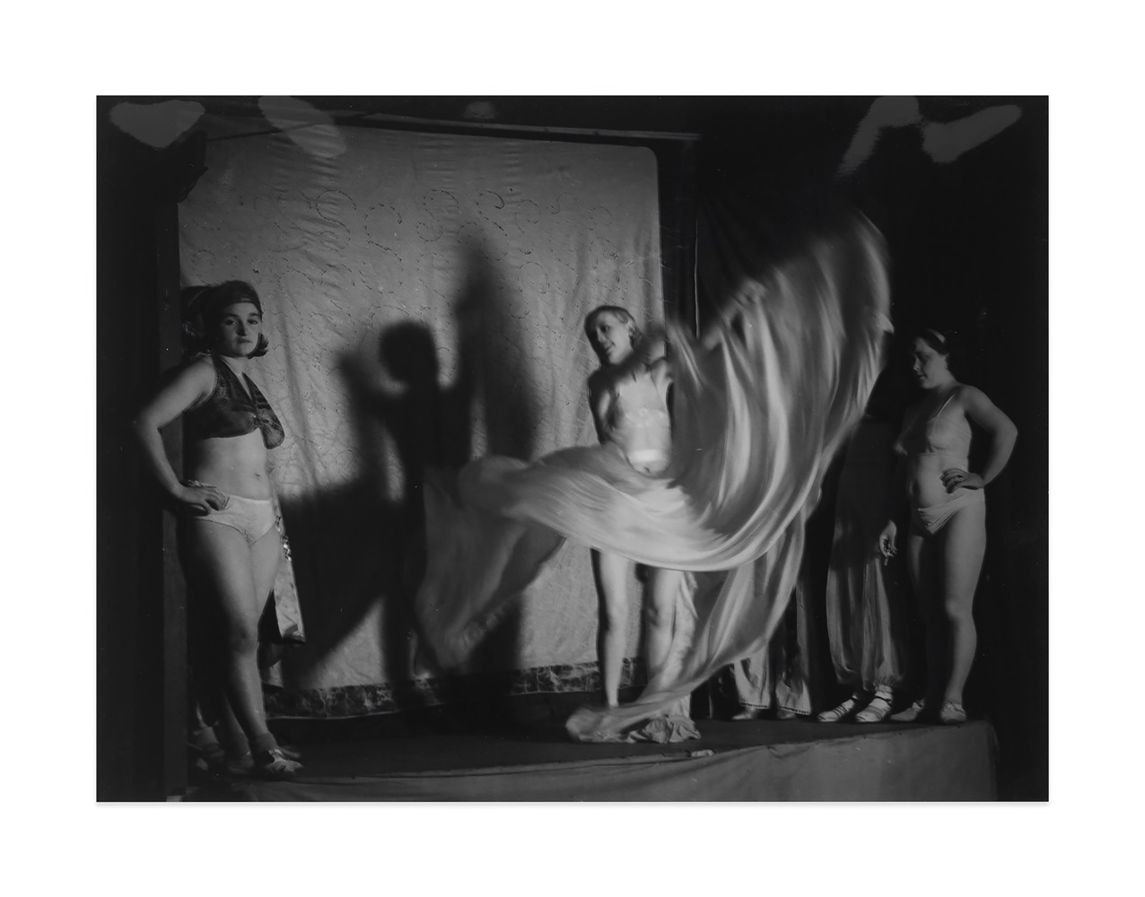 La femme de l&amp;rsquo;homme gorille, dans sa danse de Lo&amp;iuml;e Fuller, place d&amp;rsquo;Italie&amp;nbsp;(The woman of &amp;lsquo;The Gorilla Man&amp;rsquo;, a dance by Lo&amp;iuml;e Fuller, Place d&amp;rsquo;Italie), 1933&amp;nbsp;
ferrotype gelatin silver print on single weight paper&amp;nbsp;
image: 9 1/8 x 11 3/4 in. / 23.2 x 29.9 cm

sheet: 9 1/8 x 11 3/4 in. / 23.2 x 29.9 cm&amp;nbsp;

verso:&amp;nbsp;signed, stamped &amp;lsquo;COPYRIGHT by BRASSA&amp;Iuml; 81, Faubourg St. Jacques PARIS 14eme T&amp;eacute;l. 707.23.41&amp;rsquo;; &amp;lsquo;Tirage de l&amp;rsquo;Auteur&amp;rsquo;, inscribed &amp;lsquo;Pl. 837&amp;rsquo;; &amp;lsquo;PN1005/1&amp;rsquo;&amp;nbsp;