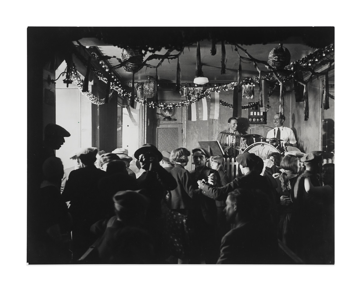 Le Bal des Quatre-Saisons&amp;nbsp;(Bal des Quatre-Saisons), c. 1932
ferrotype gelatin silver print on single weight paper
image: 8 7/8 x 11 1/2 in. / 22.5 x 29.2 cm

sheet: 8 7/8 x 11 1/2 in. / 22.5 x 29.2 cm

verso:&amp;nbsp;signed, stamped &amp;lsquo;COPYRIGHT by BRASSA&amp;Iuml; 81, Faubourg St. Jacques PARIS-XIVe T&amp;eacute;l. 707.23.41&amp;rsquo;; &amp;lsquo;Tirage de l&amp;rsquo;Auteur&amp;rsquo;, inscribed &amp;lsquo;Le bal des Quatre-Saisons&amp;rsquo;; &amp;lsquo;Pl. 22&amp;rsquo;; &amp;lsquo;PN1033/1&amp;rsquo;&amp;nbsp;