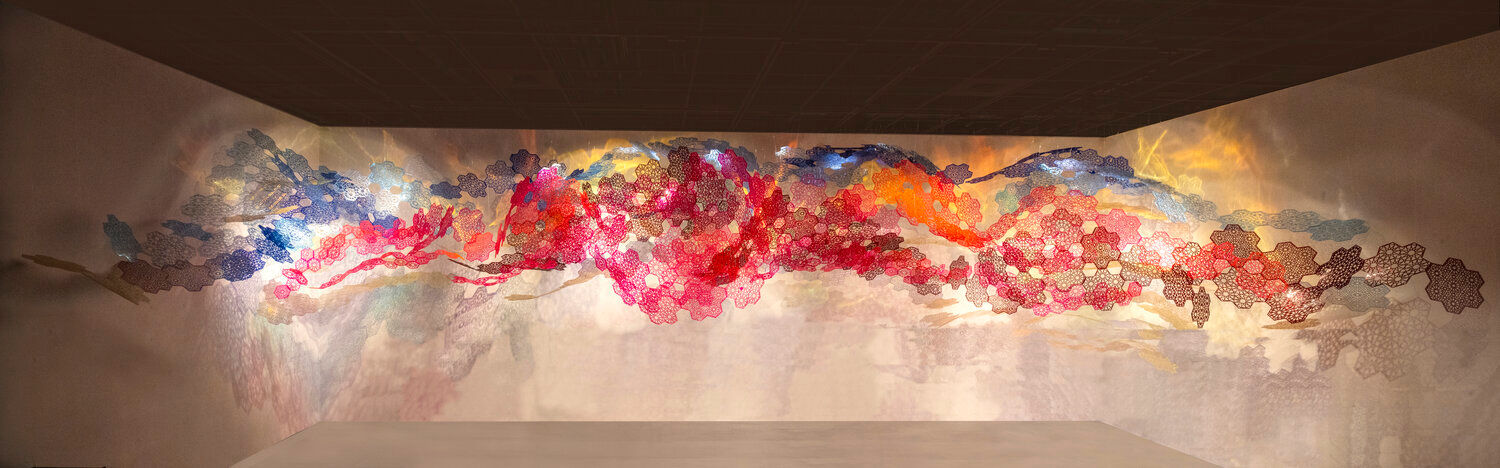 Sarah Ahmad
Cosmic Veils
2020
Laser-cut fluorescent and transparent acrylic and dichroic film
​408 x 168 x 168&amp;nbsp;in. and 201 x 138 x 120 in.