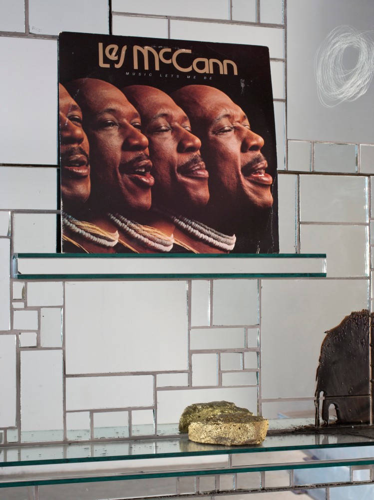 Rashid Johnson
The Moment of Creation, 2011 (detail)
mirrored tile, black soap, wax, vinyl, cb radio, plant, books, oyster shells, shea butter, space rocks, and ink jet photograph on glass
71 x 129 1/4&amp;nbsp;x 8 inches
(180.3 x 328.3 x 20.3 cm)
Photo by Martin Parsekian