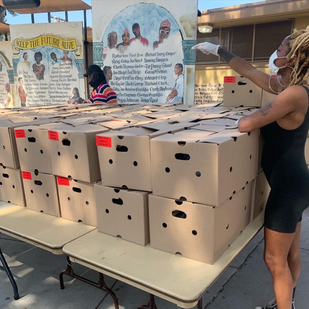 Monique McWilliams distributing packed produce boxes to the community&amp;nbsp;in South Central LA&amp;nbsp;