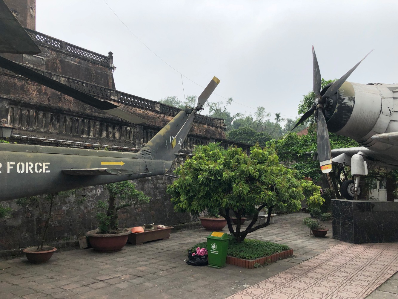 Huey Helicopter and&amp;nbsp;AD-5 Skyraider at the Vietnam Military History Museum, Hanoi, Vietnam. Photo: Matthew Brannon, 2019
