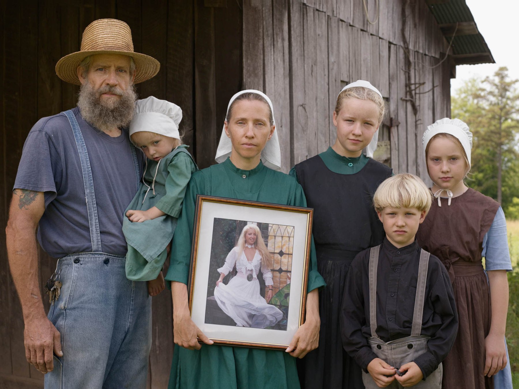 Lucas Foglia, Family Portrait with the Photograph George Took of Christina Before They Were Married, Tennessee, 2008