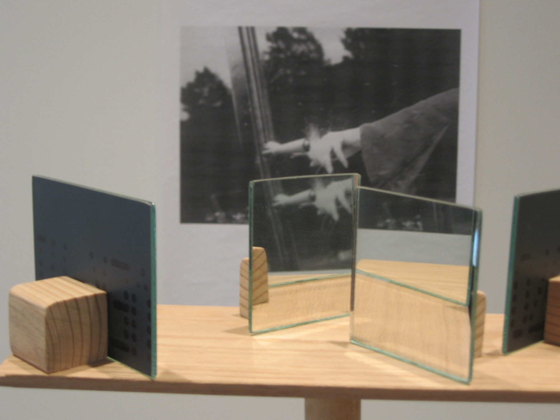 glass mirrors displayed on wooden table