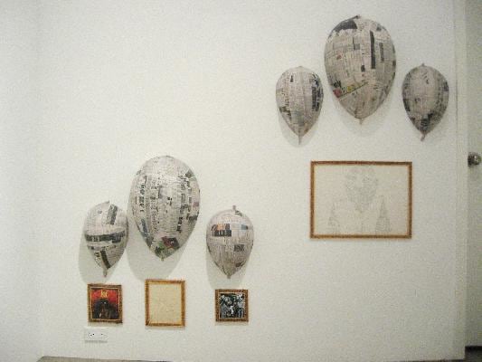 Papermache balloons on gallery walls