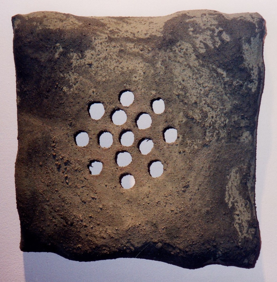 Ceramic with punched out  holes