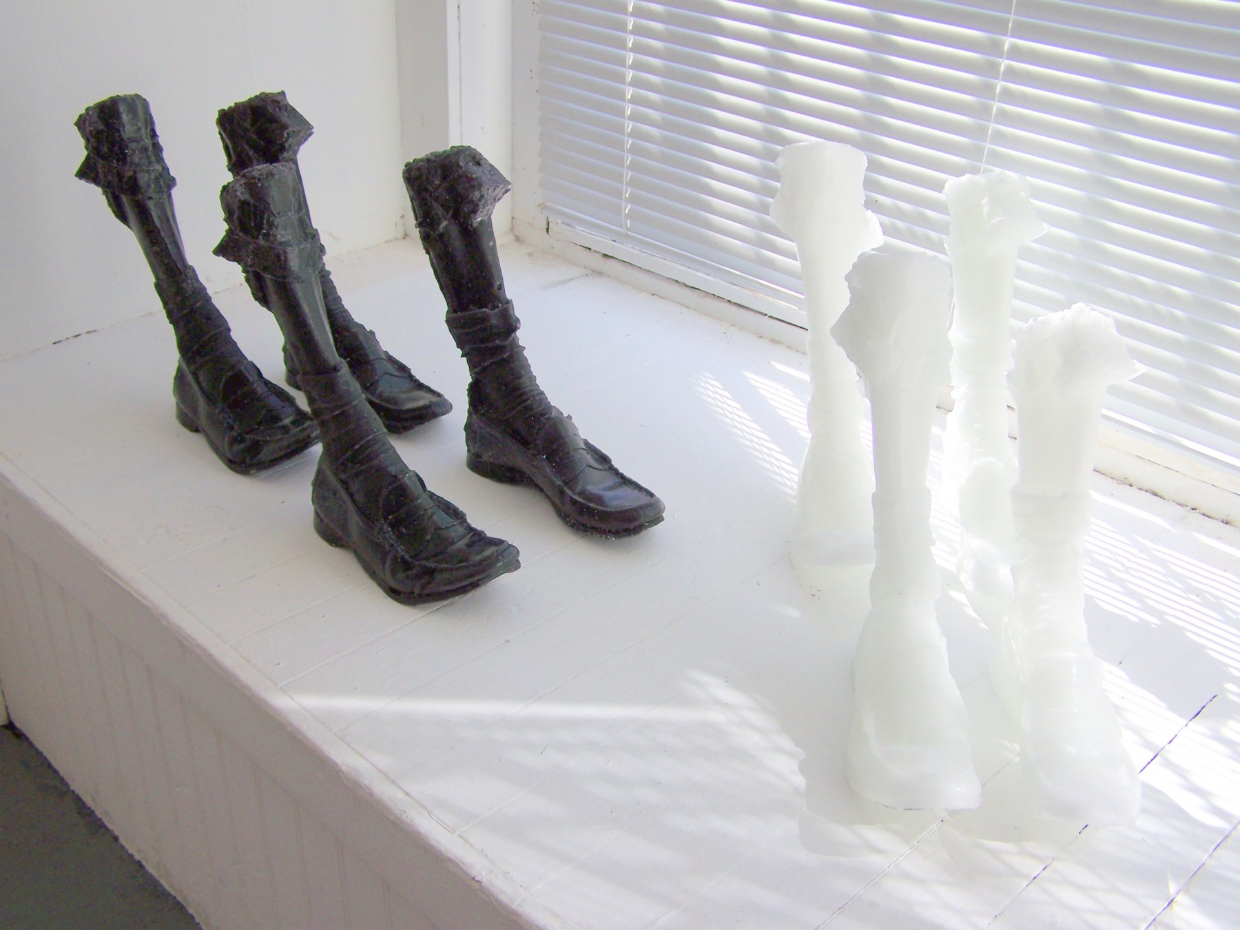 plastic legs displayed by window sill
