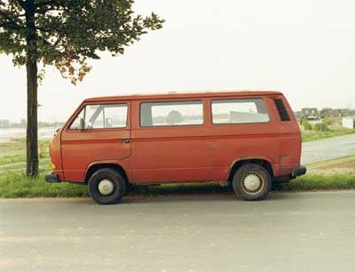 Red van parked roadside