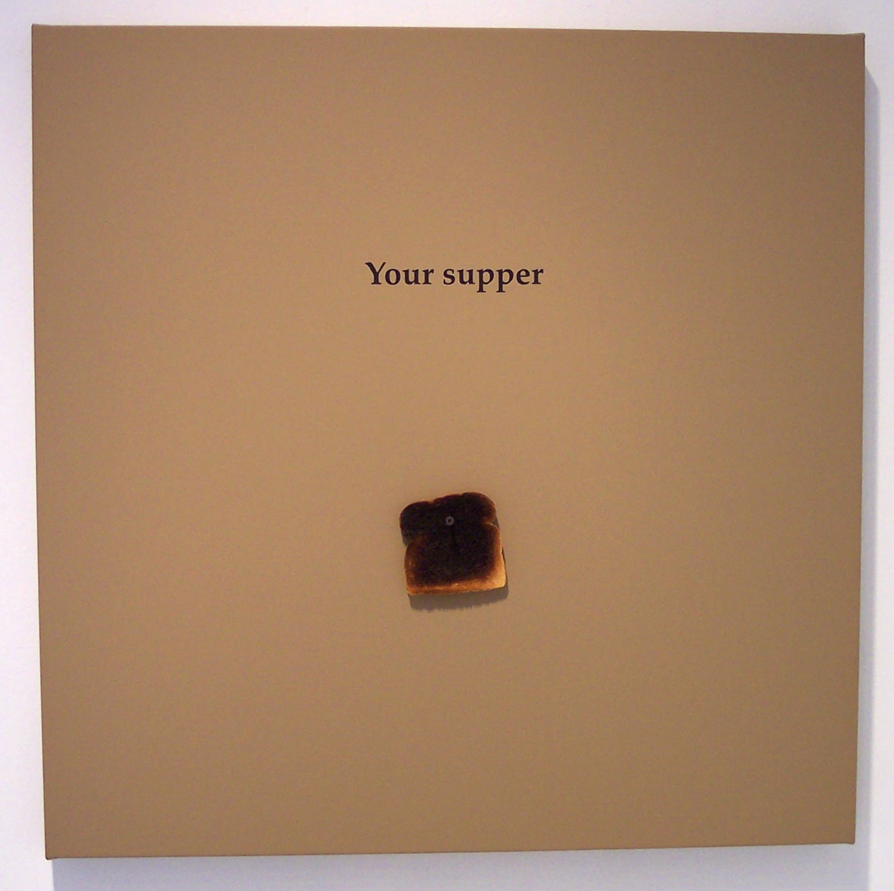 Toast on canvas, reading 'your supper'