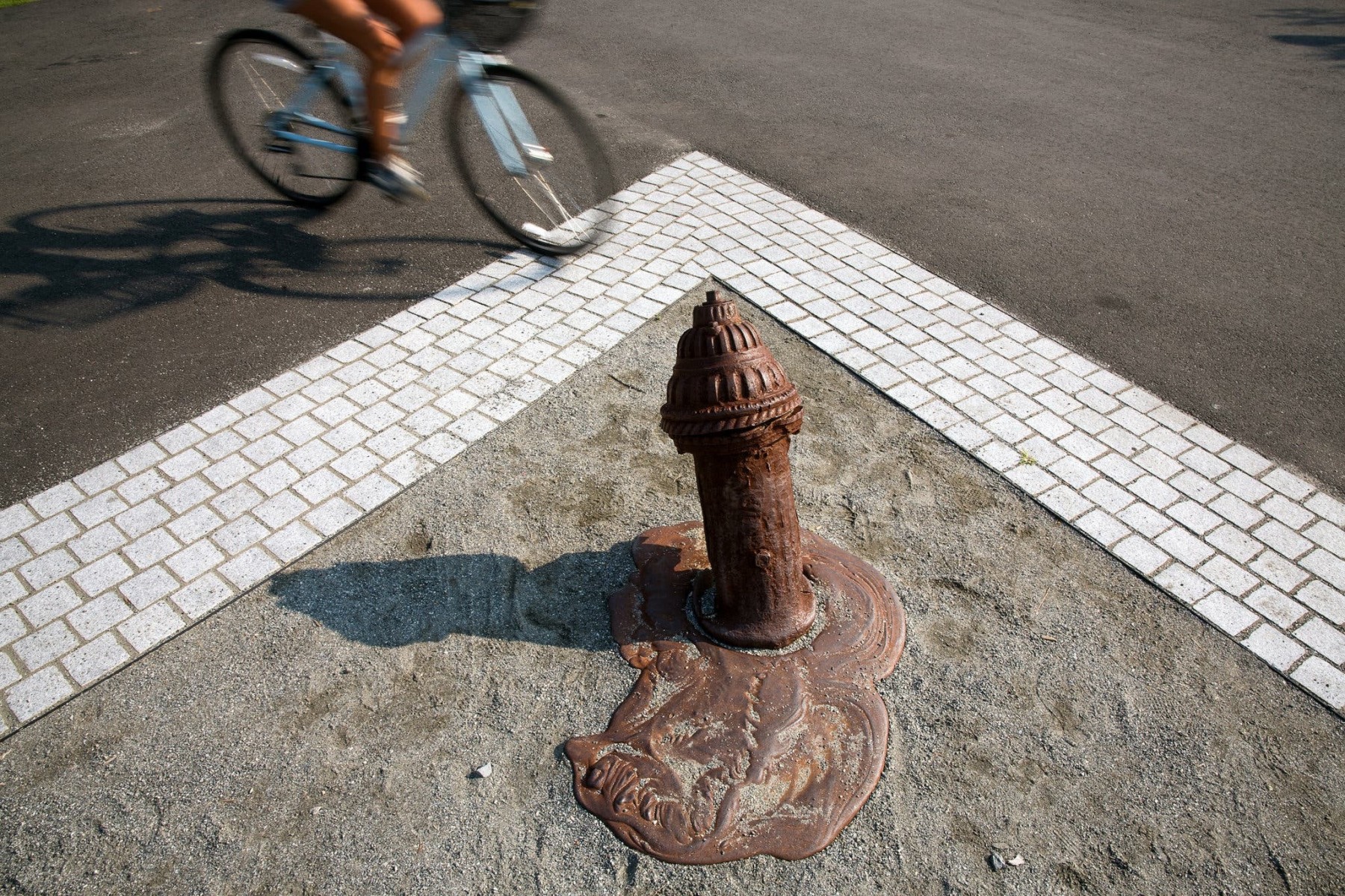 Sculpture of a fire hydrant that appears to be melting