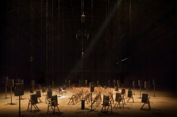 Chairs arranged in a circle facing a speaker