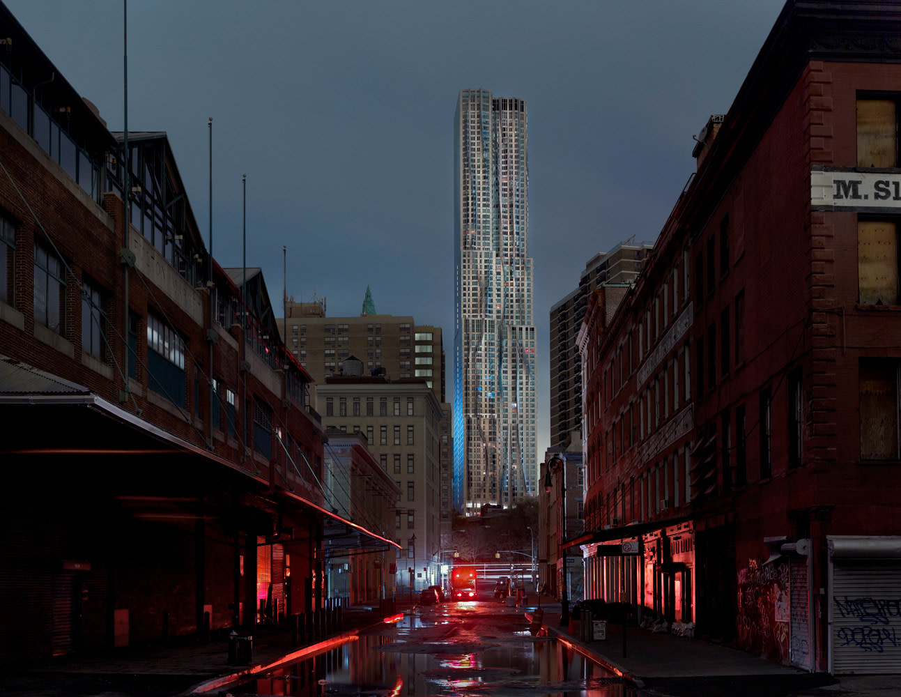 Photo of dark Manhattan street during a blackout, with a Fran Gehry skyscraper in the background.