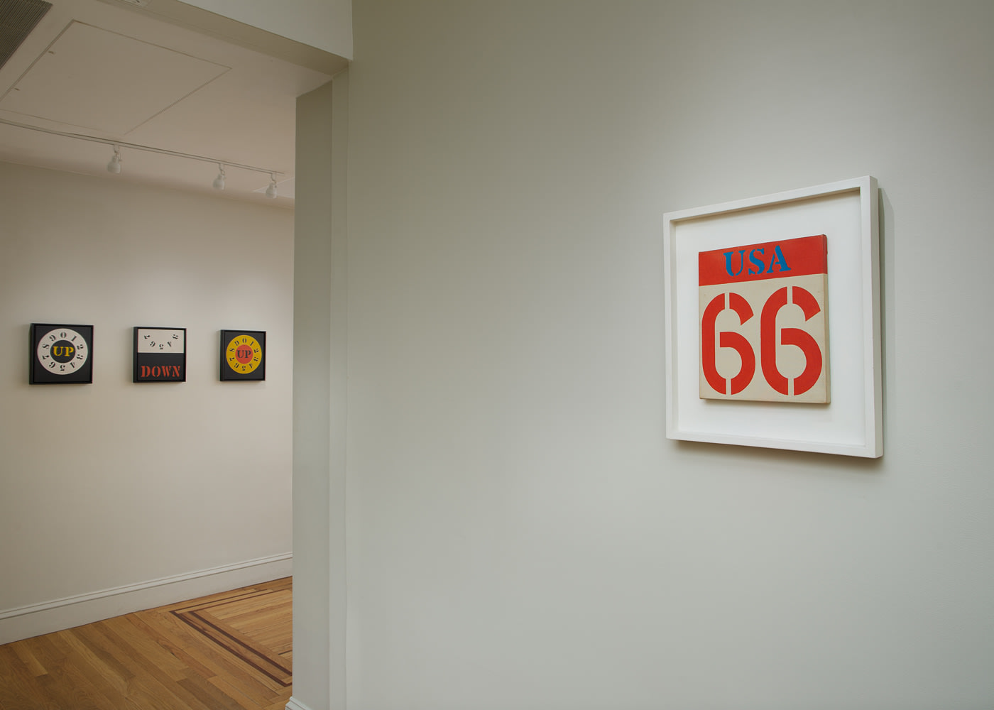 Installation view of Robert Indiana: Sign Paintings, 1960-65 at Craig F. Starr Gallery