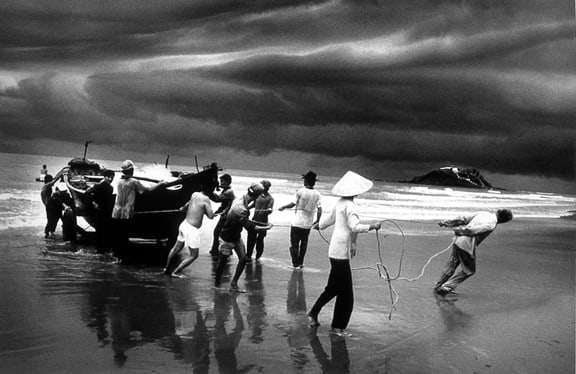 Fishermen on the beach of Vung Tau, Vietnam, from the series Migrations, 1995. 16 x 20, 20 x 24, 24 x 35, 36 x 50 or 50 x 68 inch gelatin silver print