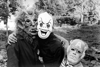 Three Kids with Masks, 1986, 14 x 11 inches, gelatin silver print