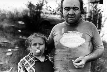 Girl Blowing Bubble with Father, 1986, 14 x 11 inches, gelatin silver print