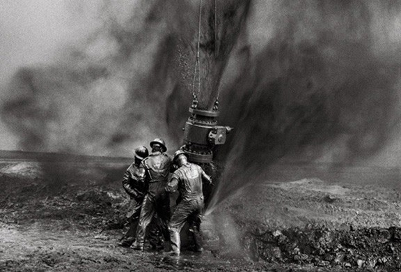 Capping a wellhead, Kuwait, from the series Workers, 1991. 16 x 20, 20 x 24, 24 x 35, 36 x 50 or 50 x 68 inch gelatin silver print