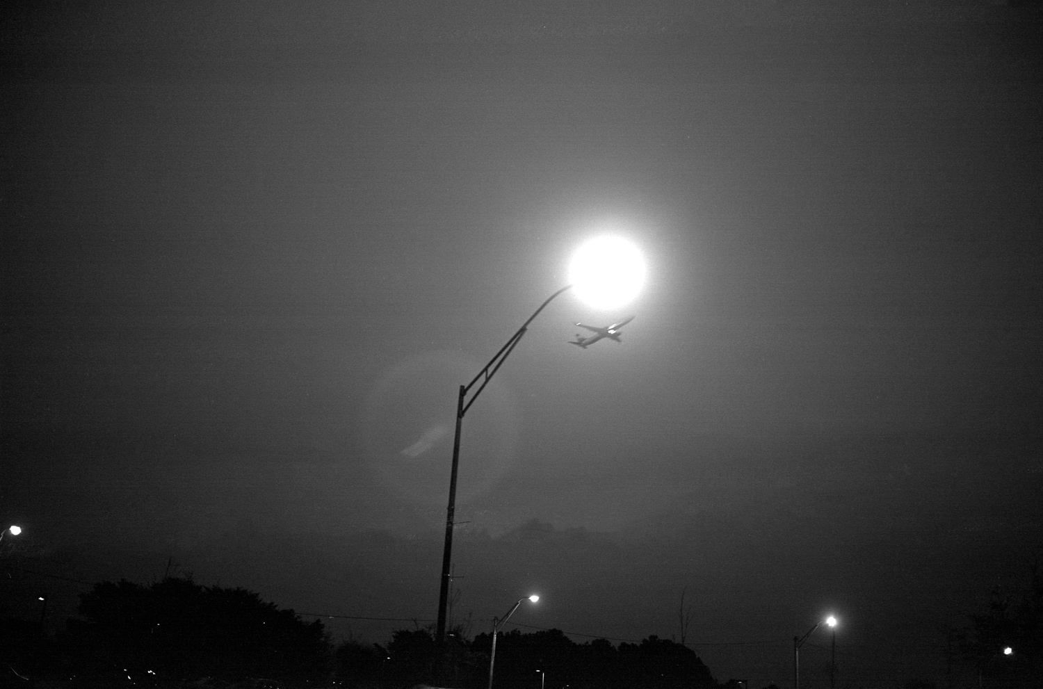 College Park, GA&nbsp;(plane and streetlight) 2016&nbsp;Gelatin silver print, please inquire for available sizes&nbsp;