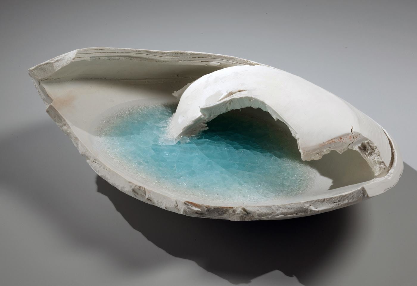 Torn, pointed oval-shaped vessel fragment with pooling of blue-green, translucent crackled glass, 2014