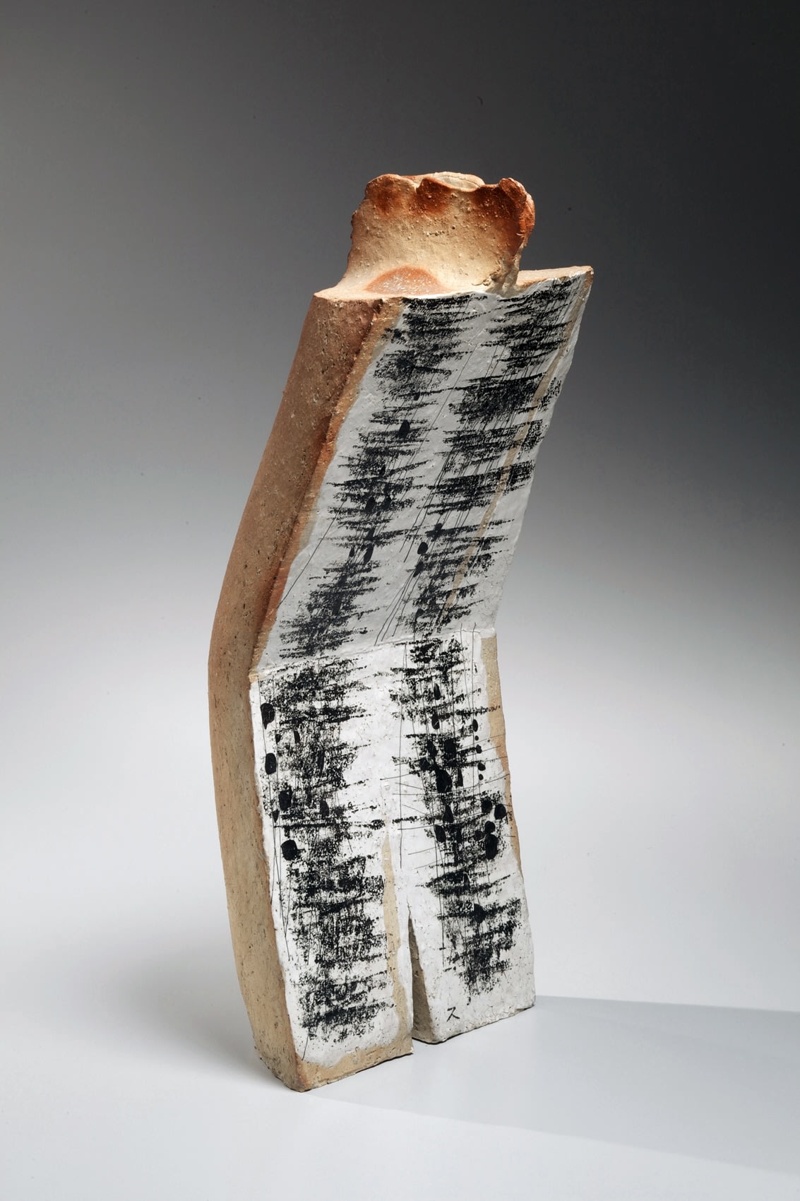 Vertical bent standing sculpture decorated on the front side, Glazed stoneware