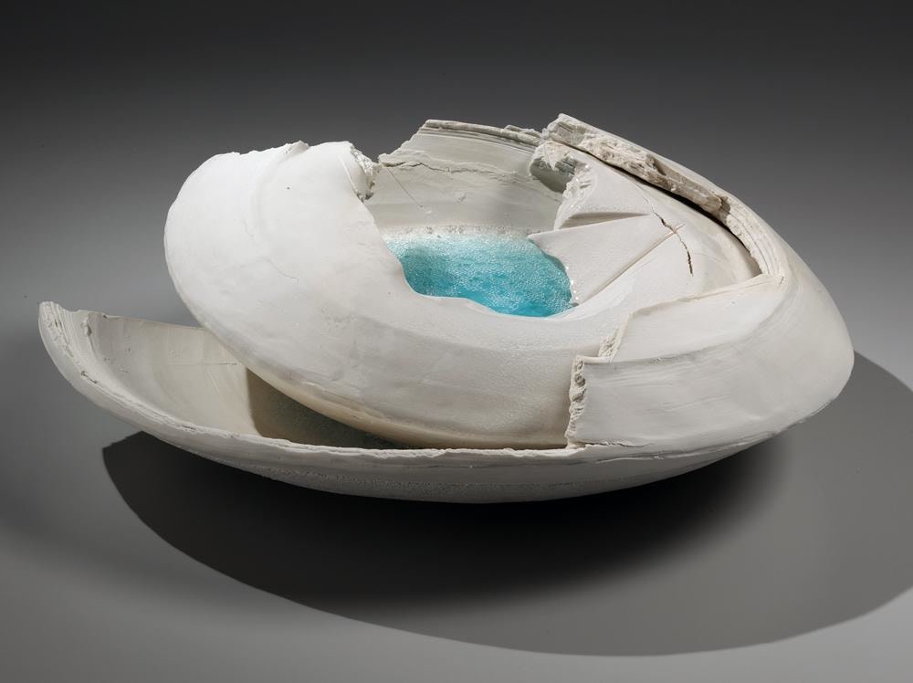 Layered, rounded vessel with pooling blue-green crackled glass in center and torn sectional edges, 2014