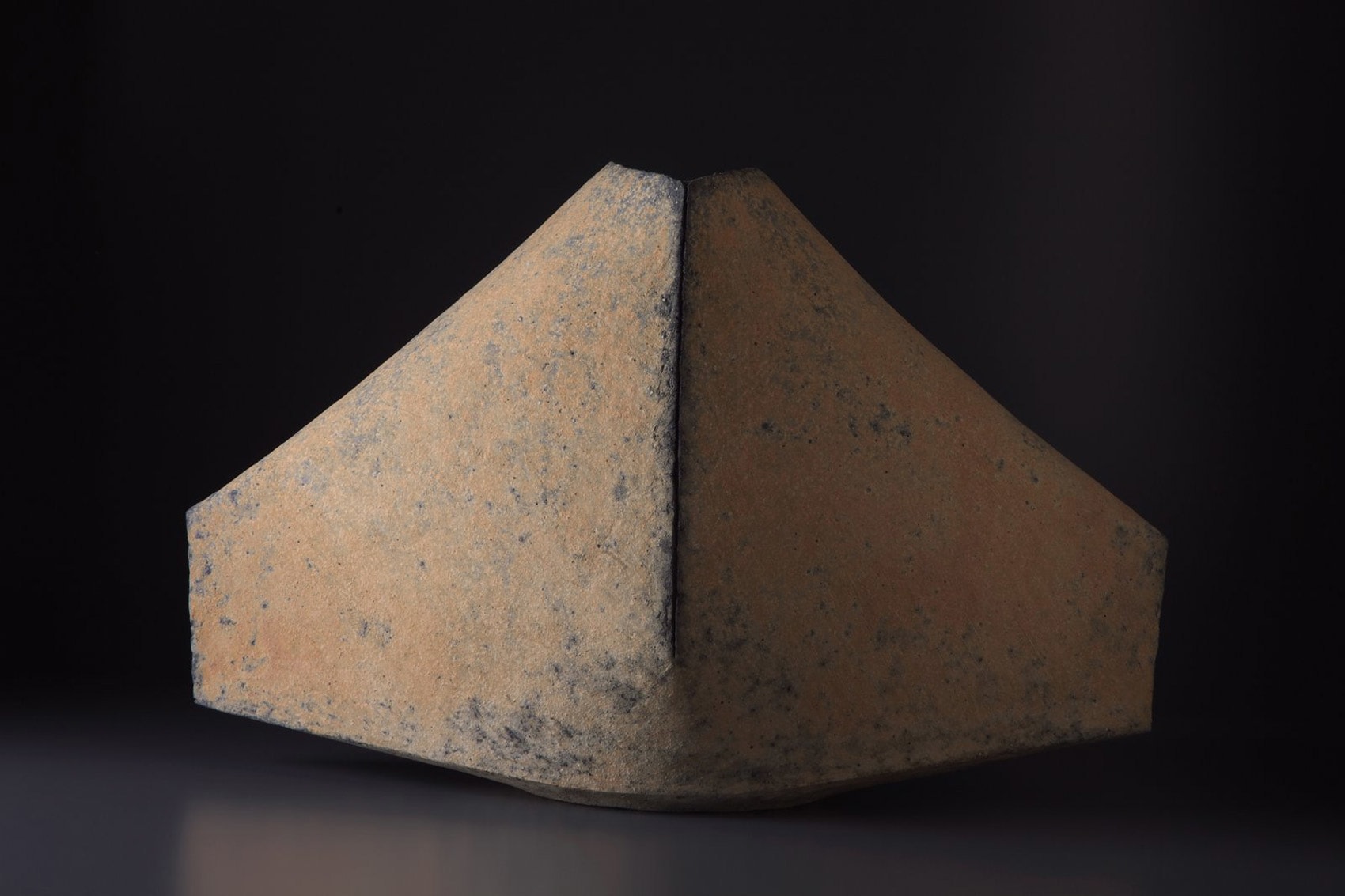 Multi-ﬁred mountain shaped vessel, scored vertical line and surface colorations, peach and #11 blue tones