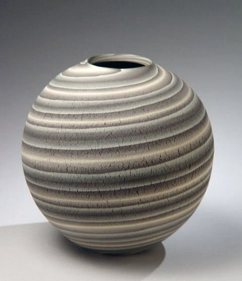 Globular vessel with textured surface with marbelized stripes of colored clay inlays, 2004