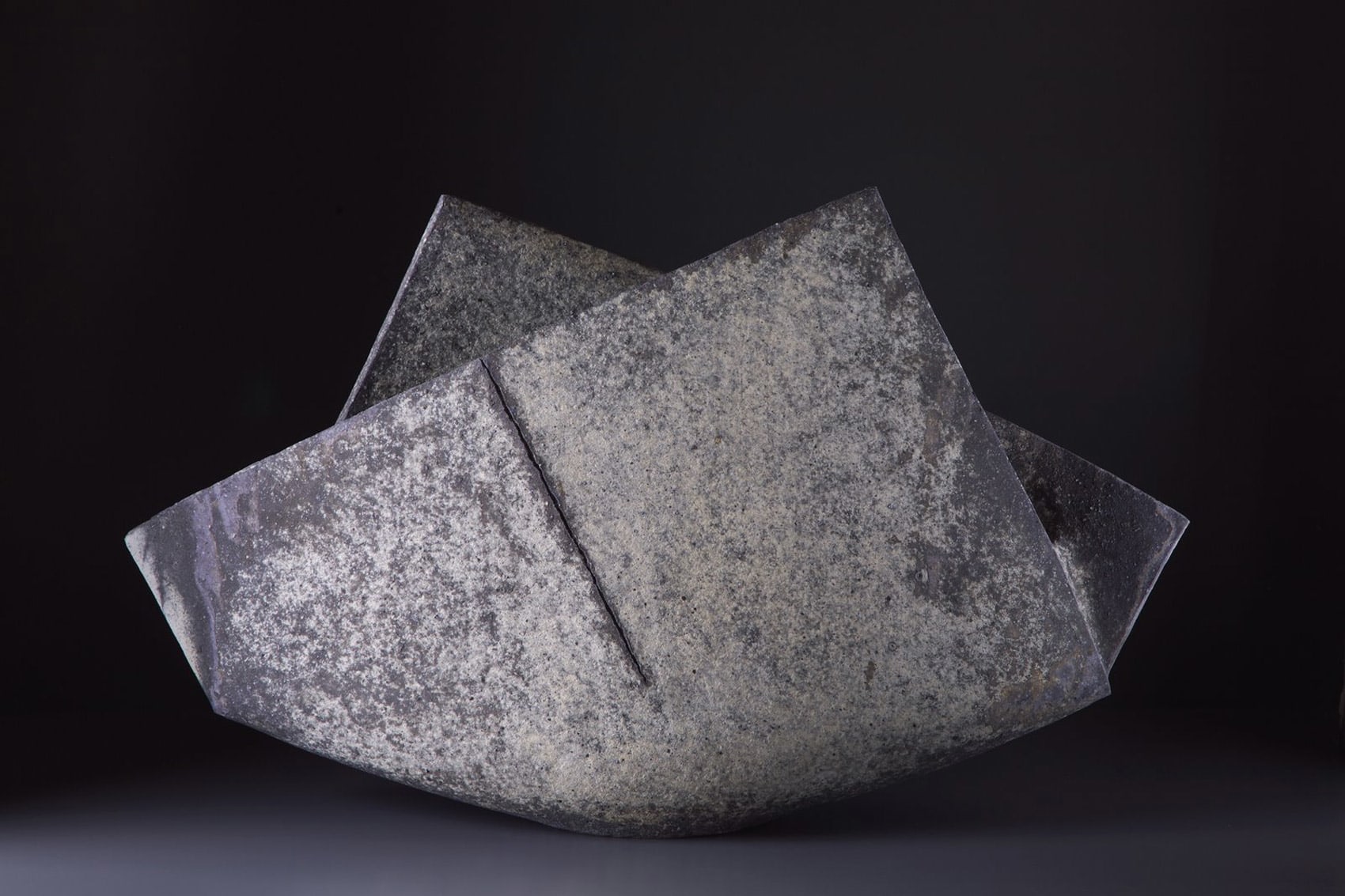 Multi-ﬁred &quot;folded&quot; vessel with scorched diagonal line, surface colorations in ash gray and blue tones (#15)