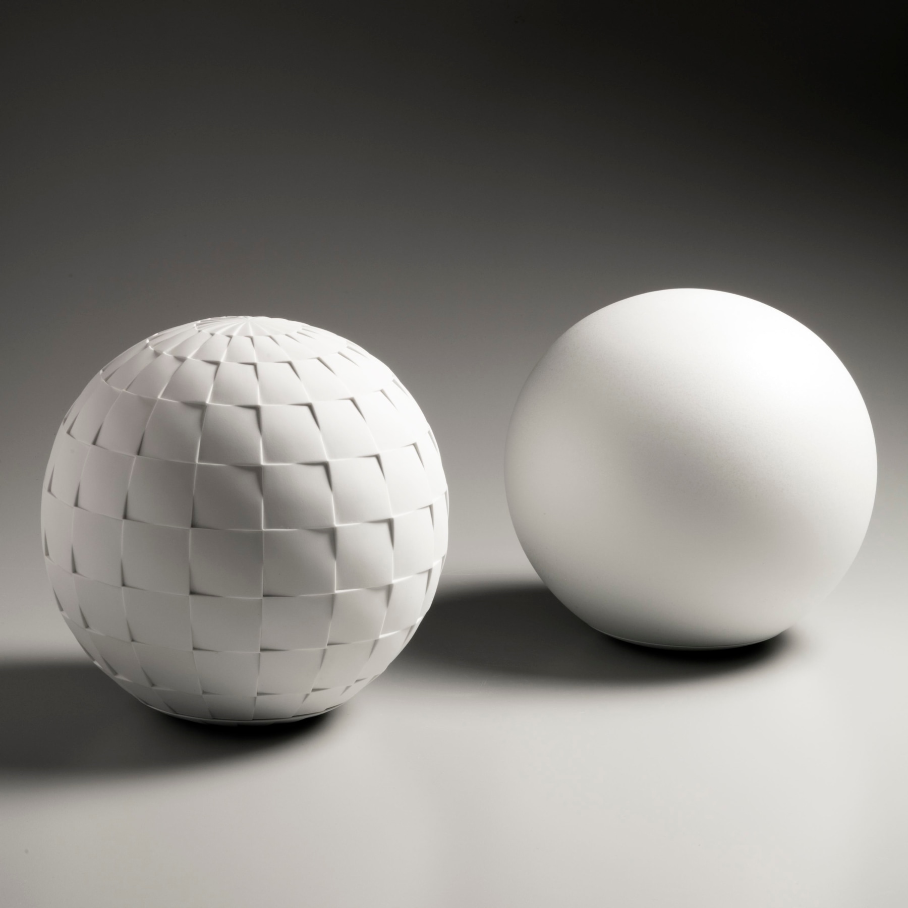 Sun and Moon; Pair of spherical, sculpted vessels with separate bases, 2016