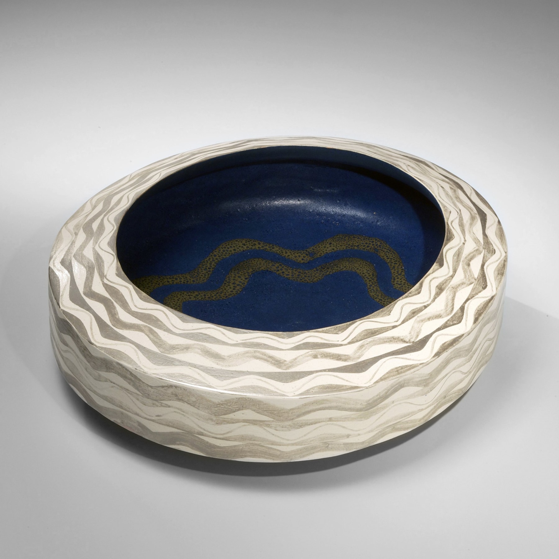 Morino Hiroaki Taimei (b.1934), Low, ovoid bowl with wave-patterned silver glaze and white, blue and gold glazed interior