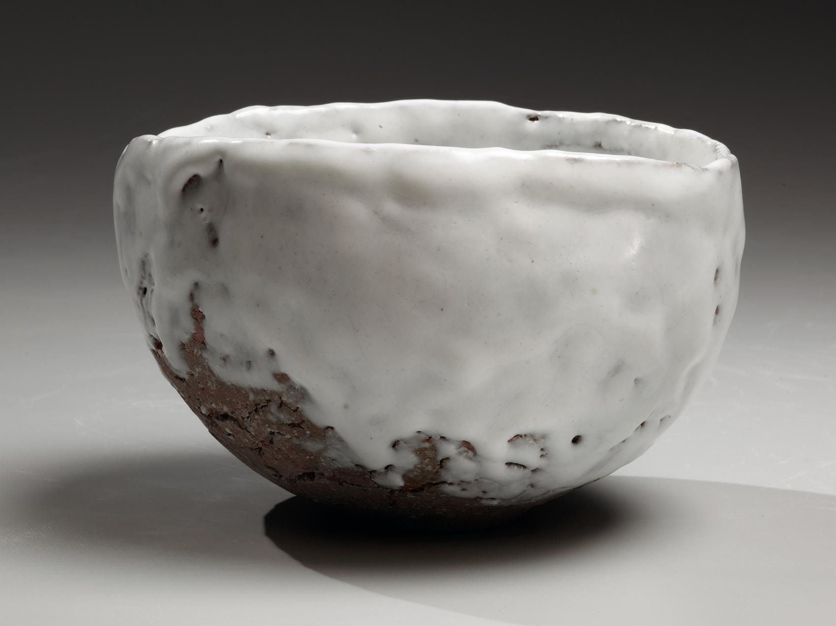 Round teabowl with unctuous white glaze over feldspar-infused crackled clay body