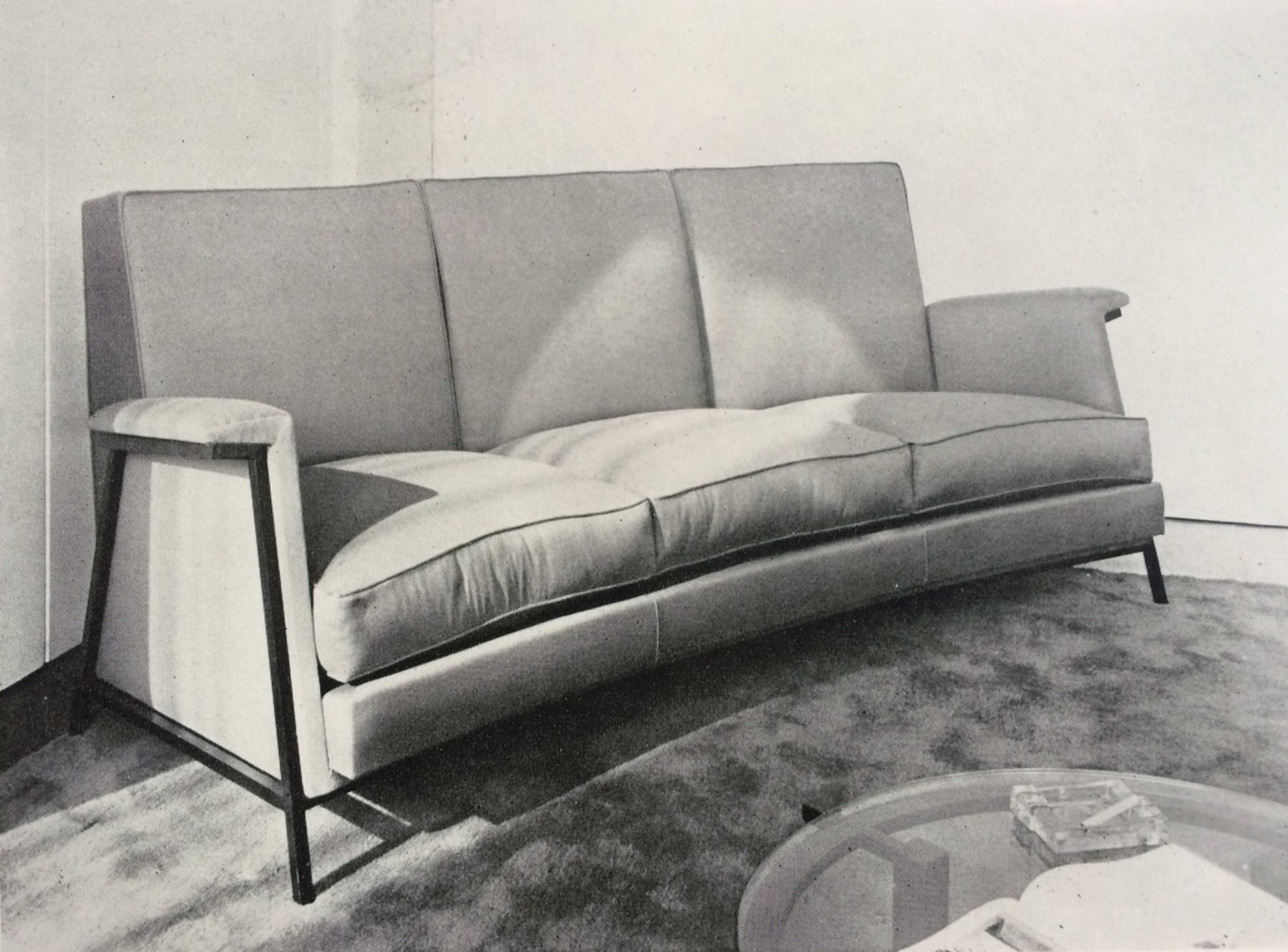 Similar sofa with apparent metal structure, c. 1956