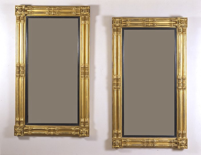 Pair Neo-Classical Pier Mirrors, about 1818. Attributed to John Doggett &amp; Company, Boston, Eastern white pine, gessoed and gilded, with ebonized liners and mirror plate Each, 65 1/8 in. high; 37 1/2 in. wide.