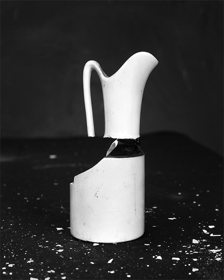 Black and white photograph of broken vase, by James Henkel