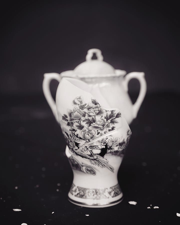 Black and white photograph of broken urn, by James Henkel