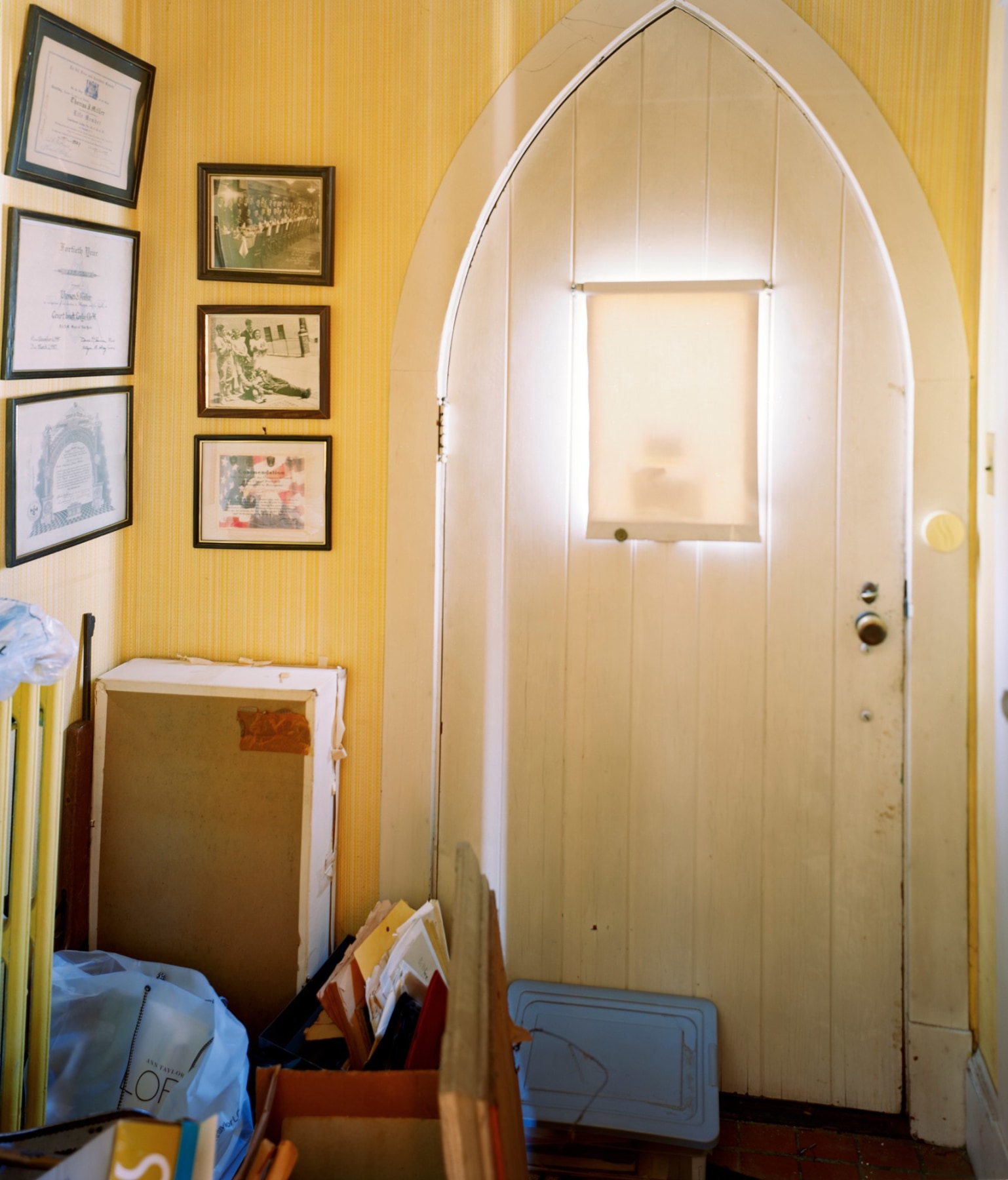 Photograph of interior of door and glowing light by Jade Doskow