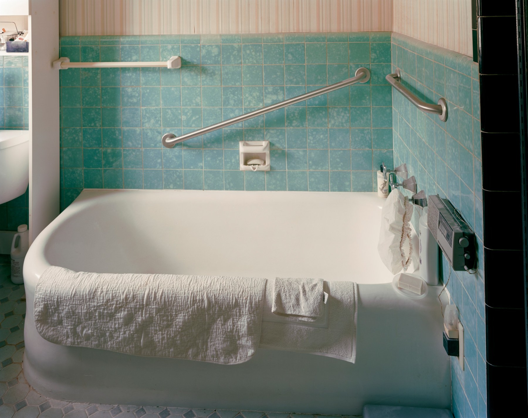 Photograph of bathtub in tiled bathroom, by Jade Doskow, by Jade Doskow