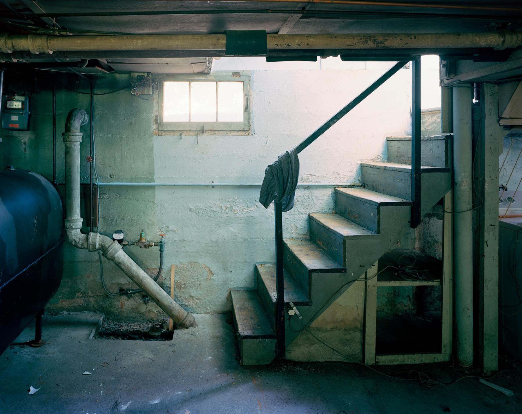 Photograph of basement stairs, by Jade Doskow