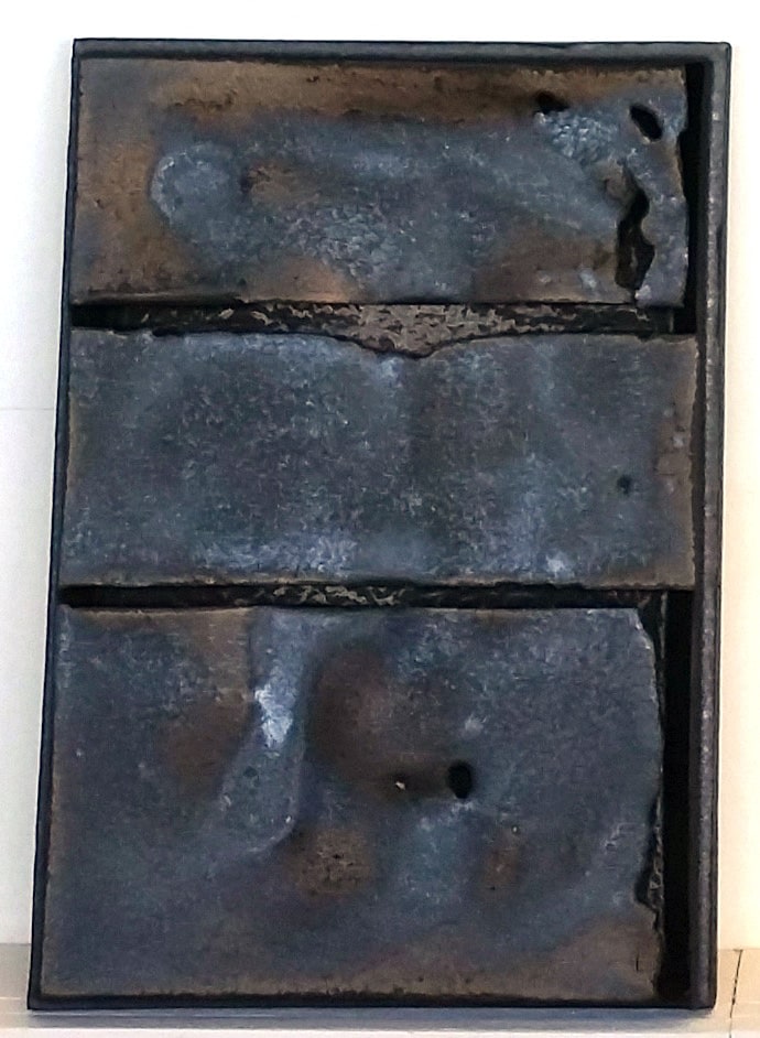 Cary Esser, Parfleche (metallic2), earthenware and glaze, 16&quot; x 12&quot; x 2&quot;, 2018, rectangular ceramic &quot;parfleche&quot; with a beautiful metallic glaze, two intentional strong horizontal void elements, and one intentional strong vertical void element along the lower right side