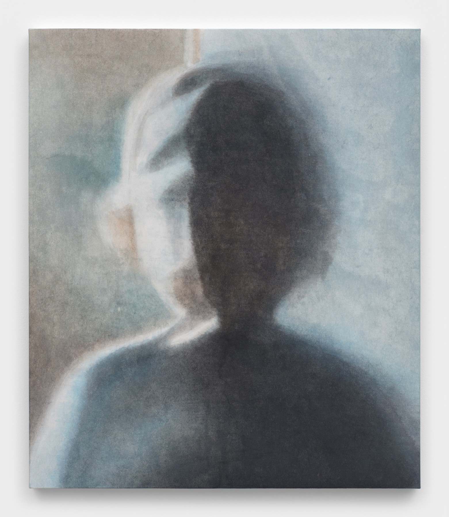 A painting of a blurry figure divided by shadow and light depicted in taupes and blues. 
