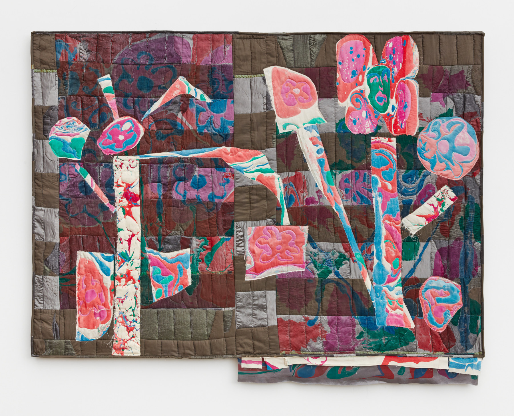 Libby Rosen's artwork "Flower Boss". Bright pink and blue swatches of fabric resembling flowers on a grey and brown background. 52 x 66 1/2 in (132.1 x 168.9 cm), acrylic, satin and batting, 2022
