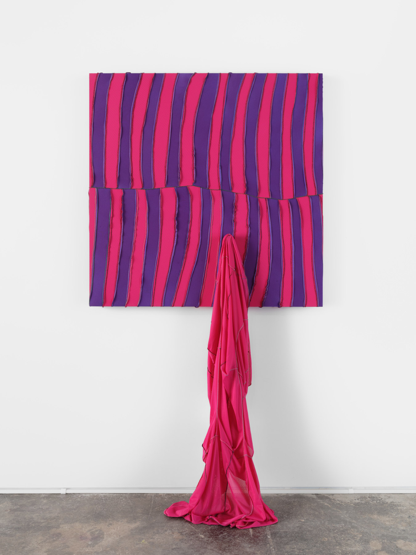 Anthony Olubunmi Akinbola artwork titled "Guess This Flavor". Pink and purple durags sewn together with a loose pink swath cascading down to the floor. 88 x 48 x 7 1/2 in (223.5 x 121.9 x 19 cm), durags on aluminum and wood frame, 2023.