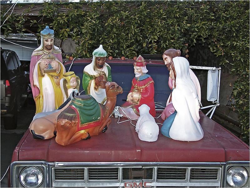 nativity scene on the hood  of a car